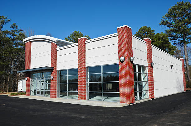 Office building with white painted walls and red brick accents by a painter in Spartanburg, SC.