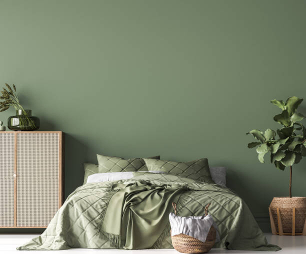 Bedroom featuring sage green painted walls and a matte finish completed by an interior painter in Simpsonville, SC