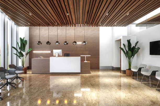 Reception area with crisp white painted walls, warm wood accents, and contemporary finishes by a commercial painter in Moore, SC