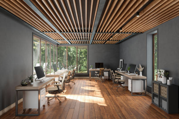 Office interior with dark gray painted accent walls and warm wood accents by a commercial painter in Moore, SC