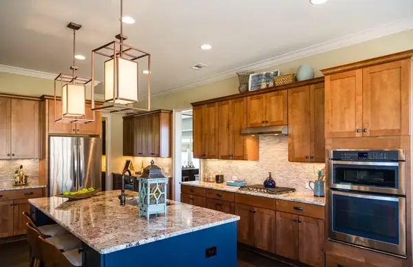 Warm wood kitchen cabinets with natural grain and professional paint finishes by a painting company in Simpsonville, SC